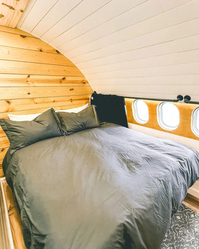 Experience a unique stay in a converted DHL jet turned Airbnb, complete with a wing deck and sauna, nestled in the breathtaking Alaskan wilderness. Book now for an unforgettable adventure!