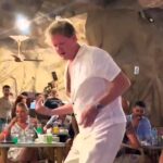 Holidaying Brits were baffled by a Gordon Ramsay lookalike chef dancing to Usher's hit in Egypt. The viral clip has fans questioning if it’s the real Hell's Kitchen star.