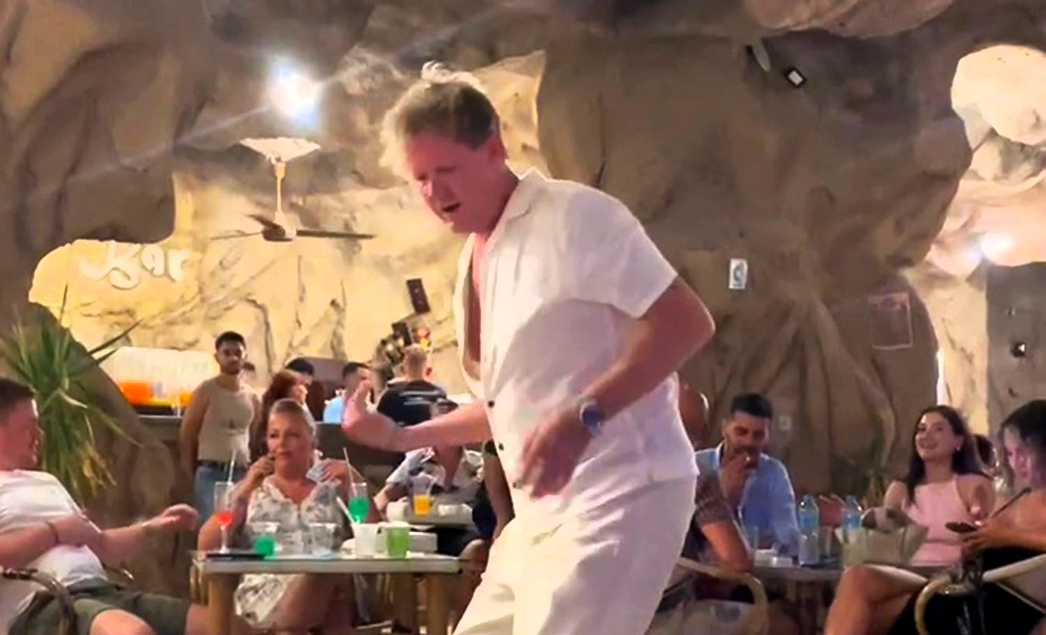 Holidaying Brits were baffled by a Gordon Ramsay lookalike chef dancing to Usher's hit in Egypt. The viral clip has fans questioning if it’s the real Hell's Kitchen star.