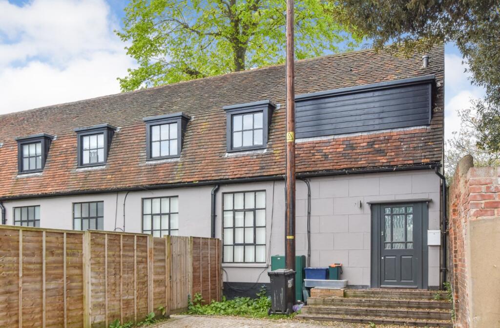 Charming two-bedroom home in Maldon, Essex, with graveyard views just meters from the door, on sale for £250,000. Perfect for those who love a spooky, historic setting.