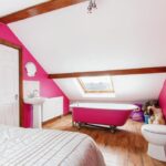 Quirky £360K Leeds home hits the market with a toilet just inches from the bed in a pink-themed bedroom, plus four more bedrooms, open-plan kitchen, and a garden.