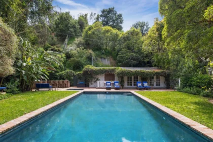 The luxurious $14M estate once owned by Michelle Pfeiffer, nestled in LA's Pacific Palisades, featuring a stunning pool, lush gardens, and celebrity neighbors.