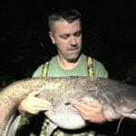 Lifelong angler Karol Vapno landed a massive 6ft, 135lb catfish on his 42nd birthday at St John's Lake, Oxfordshire, marking the catch of a lifetime after a 40-minute battle.