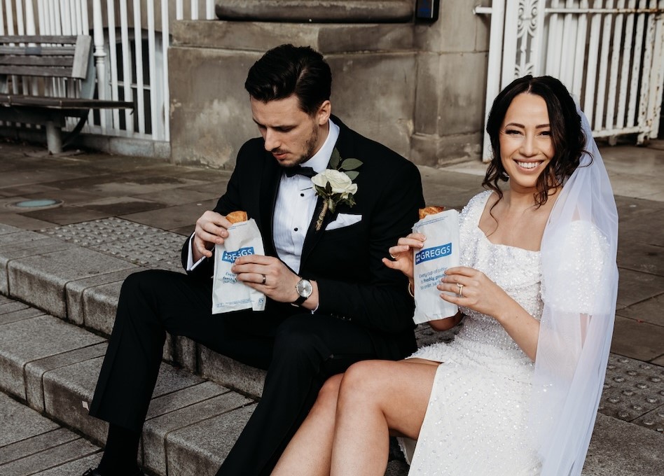 A newlywed couple celebrated with Greggs sausage rolls after their ceremony, capturing the fun moment in photos that went viral, delighting fans of the iconic British snack.