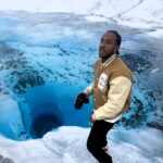 Rapper Ludacris shocks fans by drinking water directly from an Alaskan glacier, sparking concerns over potential ancient diseases. Watch the viral video that’s causing a stir!