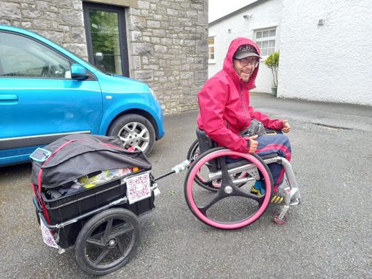 Paralyzed man Peter Smorthit defies the odds, traveling 1,000+ miles across the UK in his wheelchair, raising £12,000 for charity and inspiring others to pursue their dreams.