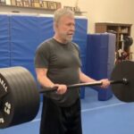 At 84, Chuck Norris stuns fans with an intense workout video, lifting heavy weights and showing off his strength, proving age is just a number for the martial arts legend.