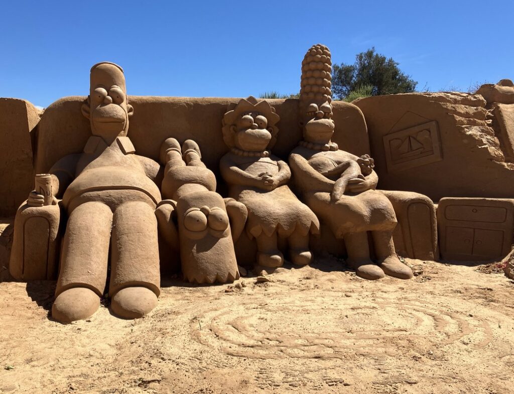 A sand sculpture of Queen Elizabeth II in Portugal remains unchanged nearly two years after her death, with errors on the plaque sparking criticism from tourists.