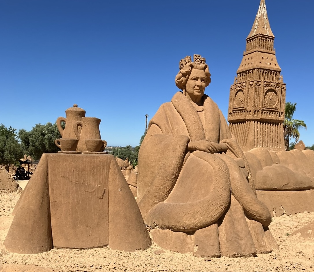 A sand sculpture of Queen Elizabeth II in Portugal remains unchanged nearly two years after her death, with errors on the plaque sparking criticism from tourists.