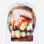 JordanLuca's £210 fashion shirt featuring rotting teeth graphics sparks outrage among shoppers. Despite the controversy, the bold design is nearly sold out.