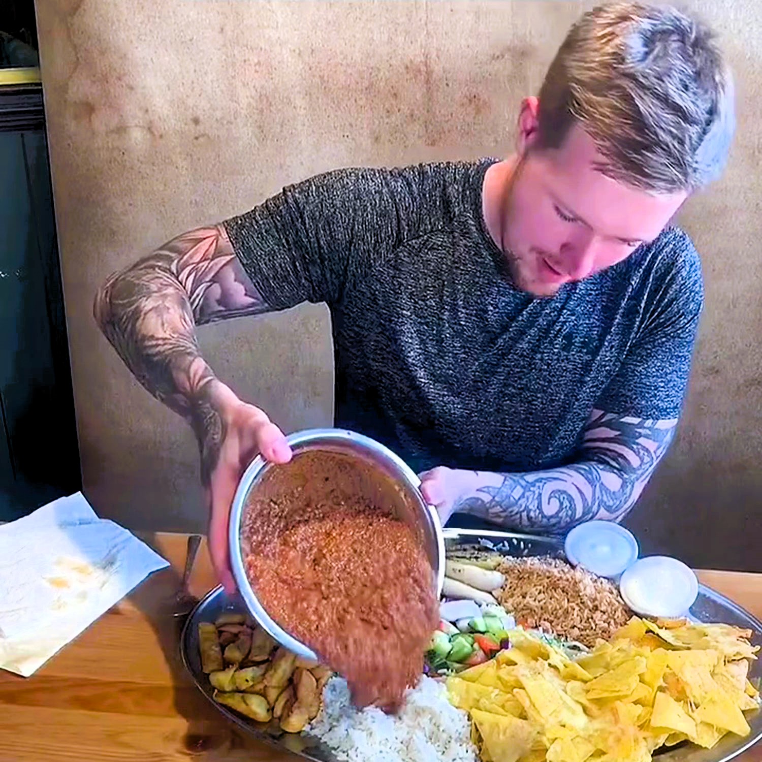 Top eater Kyle Gibson devours 7.5 lbs of chili in under an hour, winning £100. Known as Kyle v Food, he conquers mega food challenges across Britain. Video goes viral.