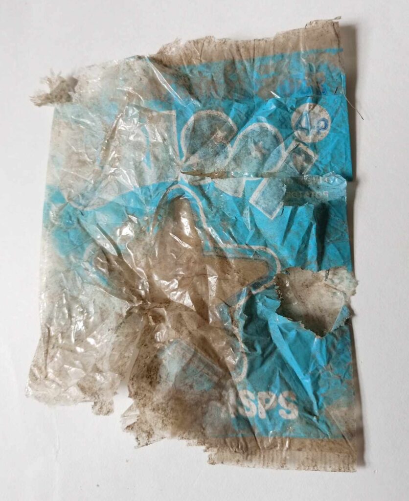 A woman in Cornwall discovered a 50-year-old crisp packet from the 1970s in her garden, highlighting the lasting impact of plastic waste on the environment.