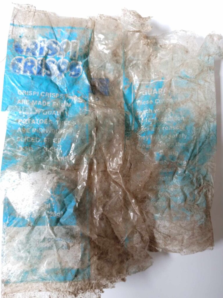 A woman in Cornwall discovered a 50-year-old crisp packet from the 1970s in her garden, highlighting the lasting impact of plastic waste on the environment.