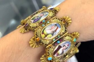 A woman discovered a $25,000 bracelet at a thrift store, dating back to 1835. The antique piece, made of 18k gold, went viral on TikTok, captivating thrifters and history buffs.