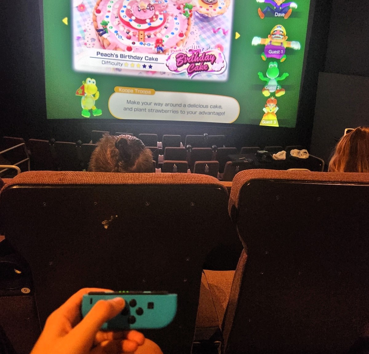 A woman and her friends rented an entire cinema screen to play Mario Party, going viral for their nostalgic gaming session. The $100 experience has inspired many online.