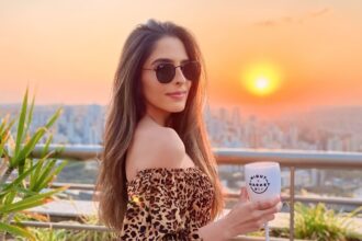 An X-rated model accuses her neighbor of being a peeping Tom, selling her nude photos online. Despite filming adult content on her balcony, she vows legal action for privacy invasion.