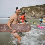 Bellyboarders from around the world competed at the World Championships in Newquay, Cornwall, showcasing their skills on wooden boards despite challenging sea conditions.