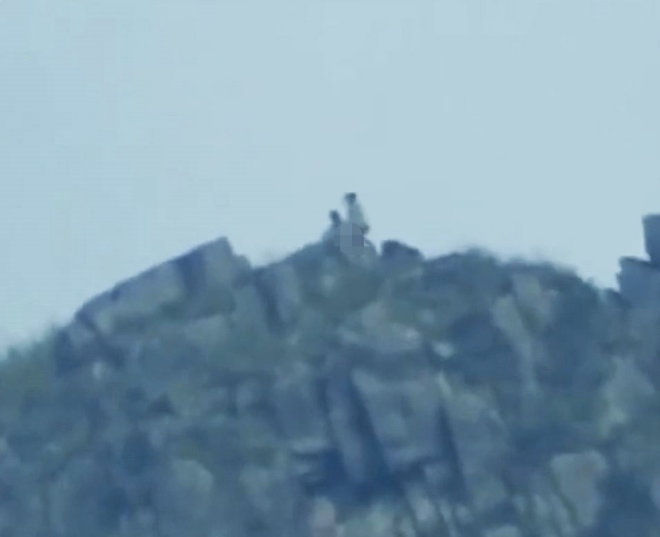 A couple caught in a risqué act on Hong Kong's Lion Rock stunned locals, but many were more impressed by the phone’s incredible zoom power that captured the distant scene.