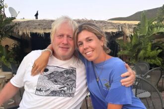 Boris Johnson flaunts a new 'rockstar' look in holiday snaps taken by his son, while wife Carrie stuns in a bikini. Fans praise their beach style.