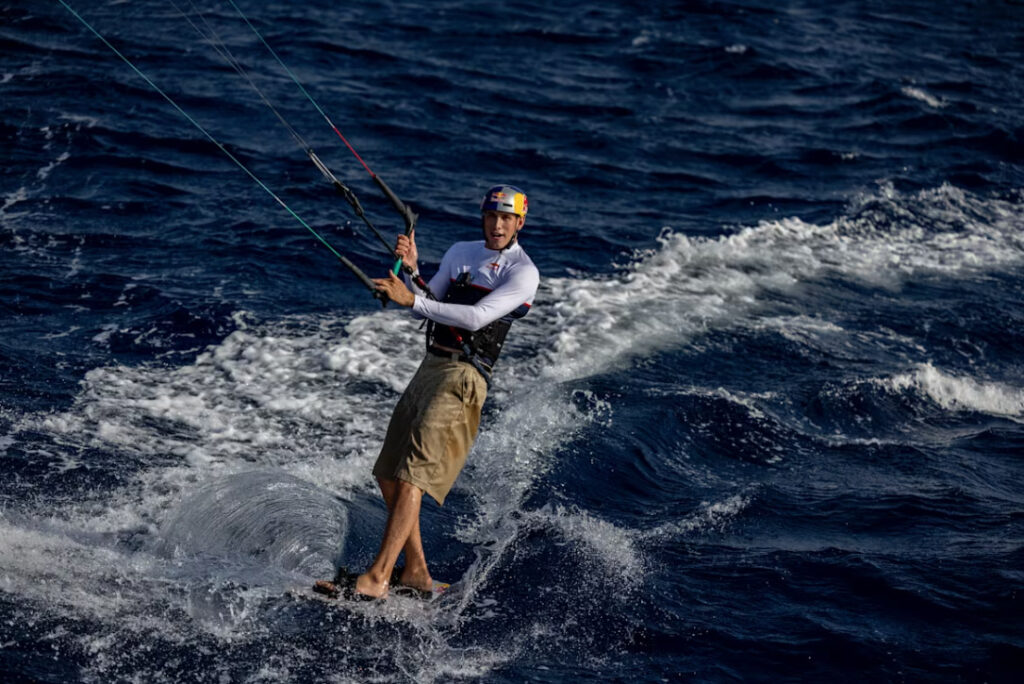 Kitesurfer Tom Bridge stunned holidaymakers by leaping 129ft from a cruise ship in Greece. The daring stunt, a year in the making, was a thrilling success.