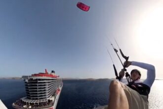 Kitesurfer Tom Bridge stunned holidaymakers by leaping 129ft from a cruise ship in Greece. The daring stunt, a year in the making, was a thrilling success.