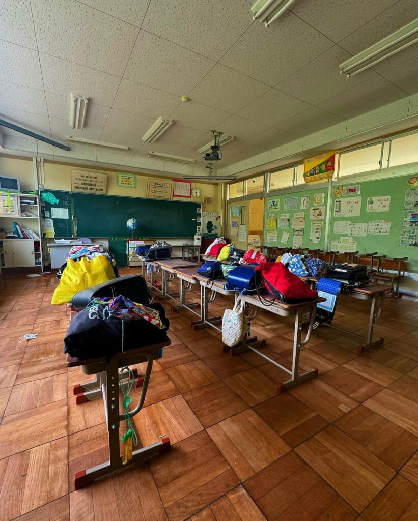 Urban explorer discovers eerie abandoned school frozen in time, with homework still pinned and a ghostly figure lurking in the hallway, sending chills down his spine."