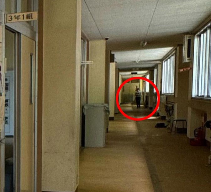 Urban explorer discovers eerie abandoned school frozen in time, with homework still pinned and a ghostly figure lurking in the hallway, sending chills down his spine."