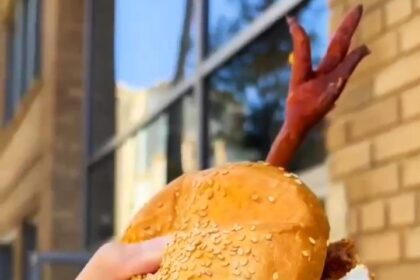 A New York restaurant's fried chicken sandwich, complete with a chicken foot poking out, has sparked debate, with some praising its freshness and others calling it off-putting.