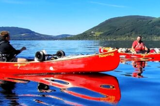 A father and son canoeing duo were struck by a mystery object on Loch Ness, sparking intrigue just days after another man was hit by a strange creature while swimming.