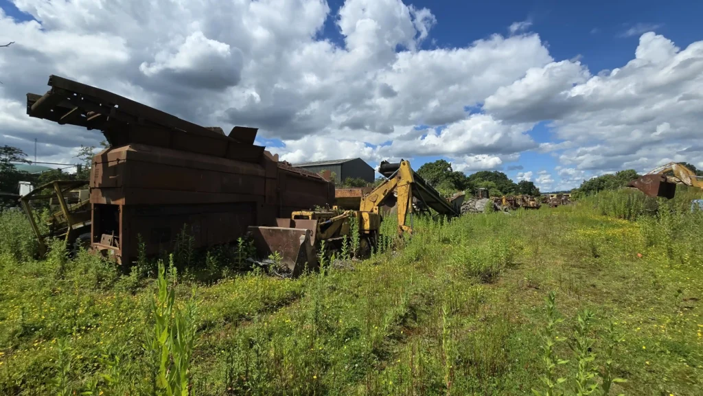 Explorer Daniel Sims uncovers an abandoned field filled with diggers and tractors worth millions in scrap metal and parts, sharing the incredible find with his YouTube followers.