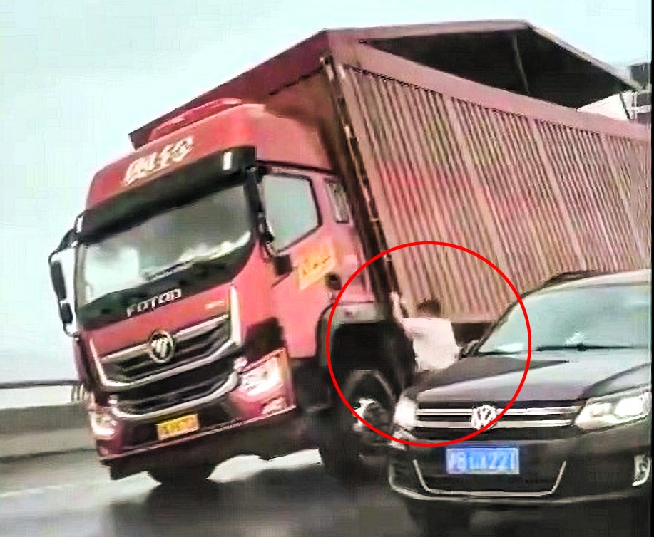 A driver clung to his van as Typhoon Bebinca's powerful winds nearly toppled it in China, where the storm forced mass evacuations and caused two fatalities in Shanghai.