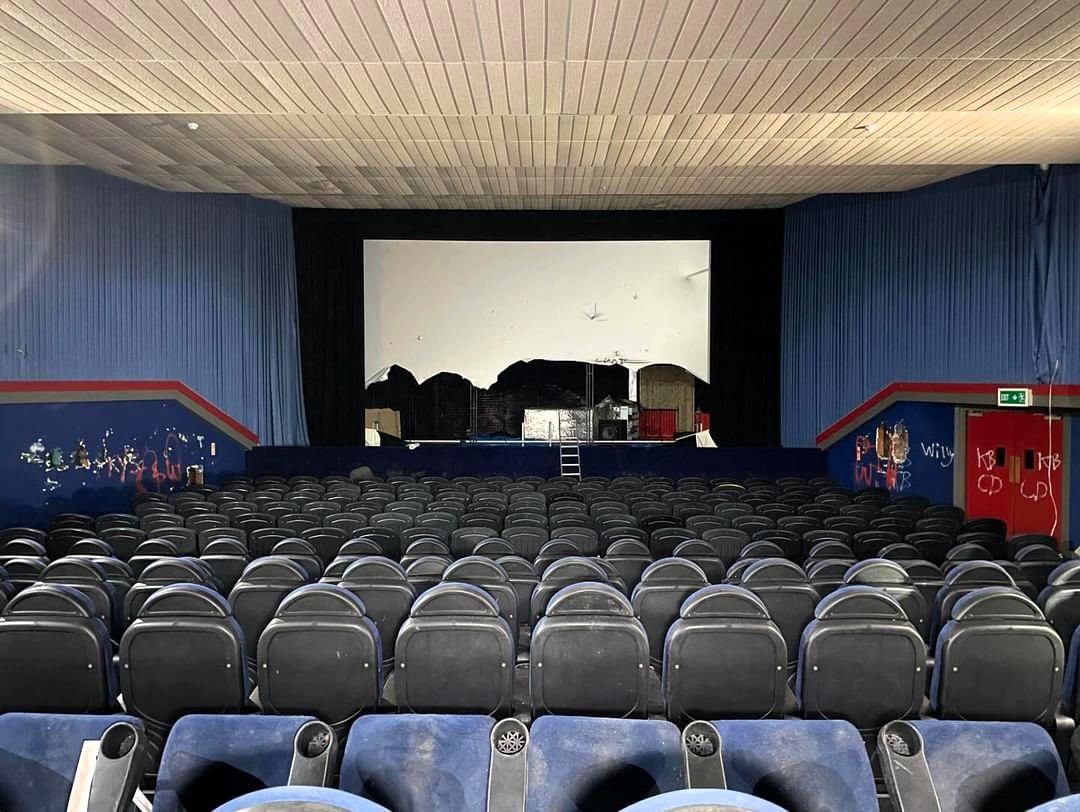 Urban explorer Sean Piper discovers an abandoned 1930s cinema in Canterbury, filled with smashed screens, litter, and eerie vibes, sparking shock and nostalgia online.