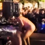 DJ Rigo Pex, aka "Meneo," shocked festivalgoers in Sonseca, Spain, by stripping naked during his set, prompting security to intervene and sparking controversy over the bizarre incident.