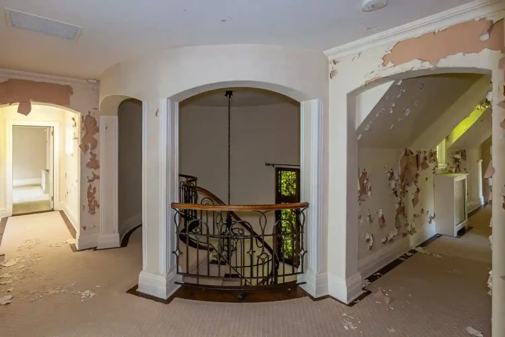 Urban explorer discovers abandoned $8.1M mansion with six bedrooms, pool, and basketball court. Once a luxurious estate, it's now set for demolition, captivating viewers.