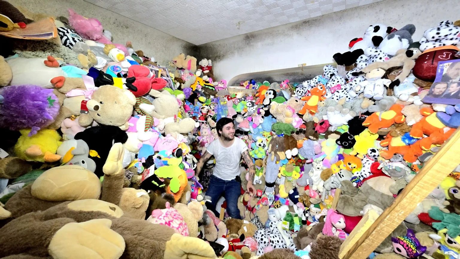 Urban explorer finds abandoned house in Liverpool filled with £100,000 worth of toys, sparking viral attention. Over 10,000 stuffed animals crammed inside the mysterious home.