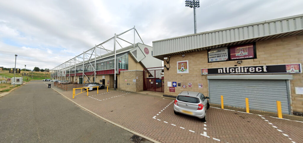 Football fans slam a £4.50 hot dog at Northampton Town’s match for its pale, bland appearance, calling it "anaemic" and joking it looks "cooked on a radiator."