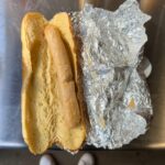 Football fans slam a £4.50 hot dog at Northampton Town’s match for its pale, bland appearance, calling it "anaemic" and joking it looks "cooked on a radiator."