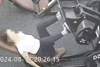 A gym-goer was hospitalized with a concussion after a leg press machine hit her in the face. The gym denies responsibility, sparking debate over facility safety measures.