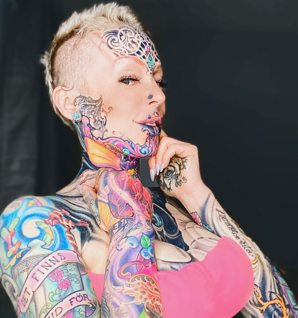 A woman with over 200 tattoos and subdermal implants shares her journey to becoming a 'human cyborg,' facing daily challenges and judgment while expressing her individuality.