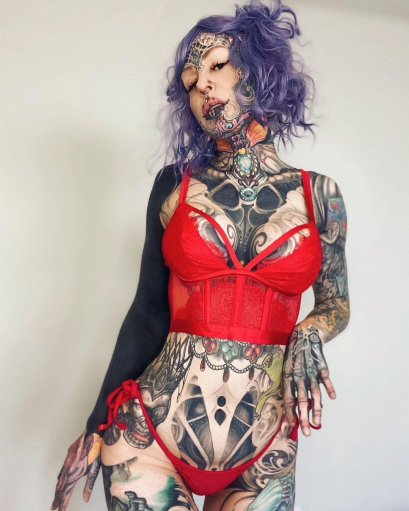 A woman with over 200 tattoos and subdermal implants shares her journey to becoming a 'human cyborg,' facing daily challenges and judgment while expressing her individuality.