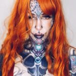 A woman with over 200 tattoos and subdermal implants shares her journey to becoming a 'human cyborg,' facing daily challenges and judgment while expressing her individuality.