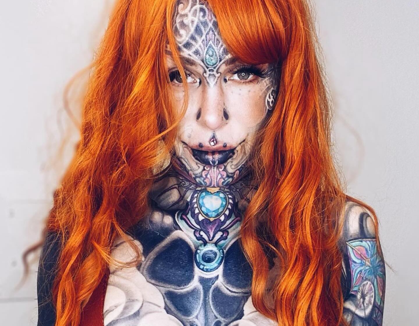 A woman with over 200 tattoos and subdermal implants shares her journey to becoming a 'human cyborg,' facing daily challenges and judgment while expressing her individuality.