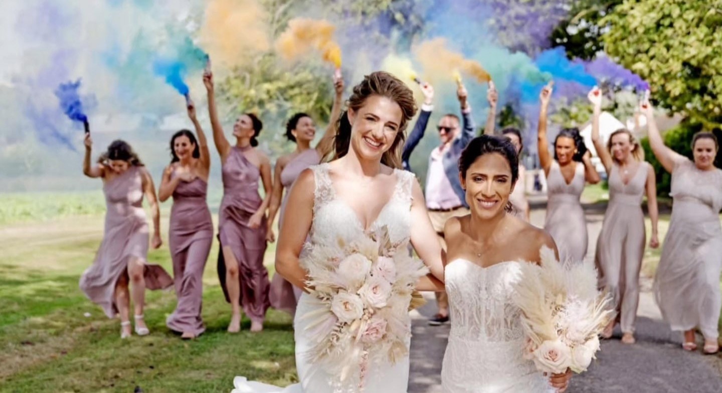 Penguin-loving couple tie the knot after a zoo proposal involving the adorable birds. Louise and Naomi’s fairytale wedding even featured penguin-themed tables and gifts!