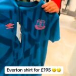 Footy fans are baffled as Selfridges sells a 2019 Everton training top for £195—£155 more than its original price. Fans question the shocking price of the outdated shirt.