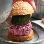 Tom Kerridge's £19.50 towering burger at The Coach in Marlow is criticized by diners who label it 'impossible' to eat and 'pompous'. Inspired by Scooby-Doo, the eight-inch stack is slammed as impractical.