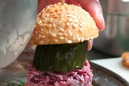 Tom Kerridge's £19.50 towering burger at The Coach in Marlow is criticized by diners who label it 'impossible' to eat and 'pompous'. Inspired by Scooby-Doo, the eight-inch stack is slammed as impractical.