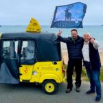 Two dairy founders, David Evans and Kevin Beer, embarked on a 1,600-mile tuk-tuk journey across the UK for BBC Children In Need, raising over £18,000 while showcasing British cheese.