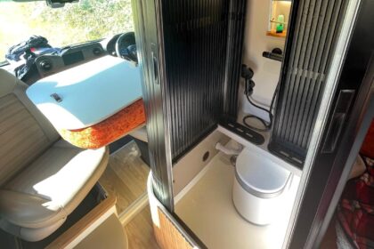 A UK couple is taking van life to the next level with their luxurious van conversions, including a motorhome featuring a hidden shower.