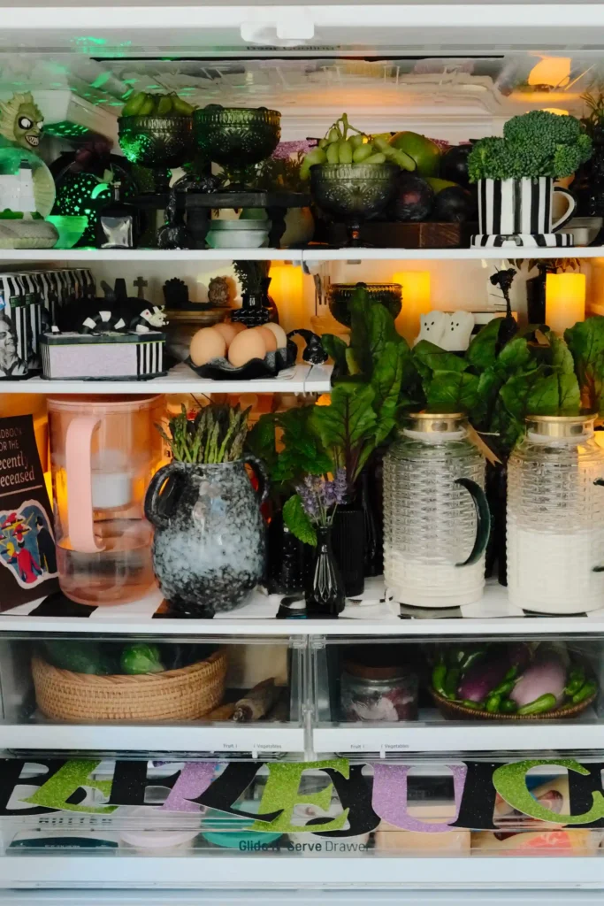 Lynzi Judish sparks debate with her viral 'fridgescaping' trend, decorating her fridge with flowers, candles, and framed pictures, turning it into a whimsical, organized space.