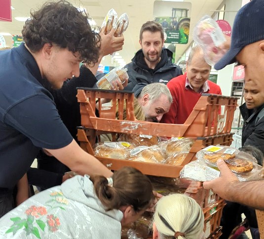 Bargain-hunters swarm Morrisons' reduced food trolley daily at 5:30pm, sparking frenzy over discounted items as low as 5p amidst the UK cost-of-living crisis.